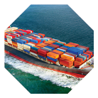 A fully stocked cargo ship heading out to sea.