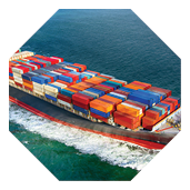 A fully stocked cargo ship heading out to sea.