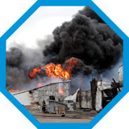 Building engulfed in smoke and fire.