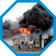 Building engulfed in smoke and fire.