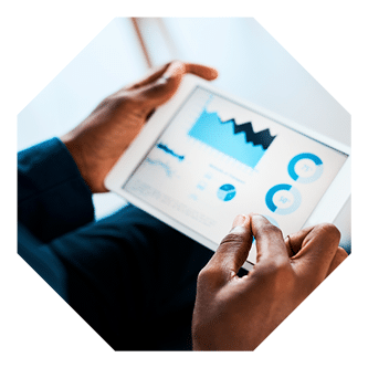 Cropped shot of a businesswoman using a digital tablet with graphs on it in a modern office