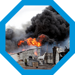 Building engulfed in smoke and fire.